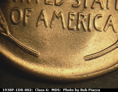 Die-stage B marker on 1938P•1DR•002 (1938 Doubled Die Reverse).