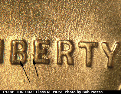 Die-stage B marker on 1938P•1DR•002 (1938 Doubled Die Reverse).
