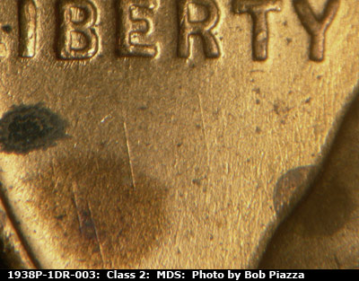 Die-stage B marker on 1938P•1DR•003 (1938 Doubled Die Reverse).