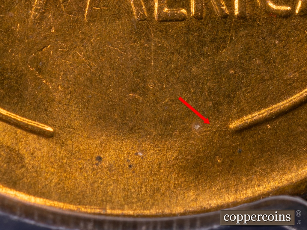 Die-stage F marker on 1938S•1MM•001 showing Scratch still visible attached to right wheat stem.