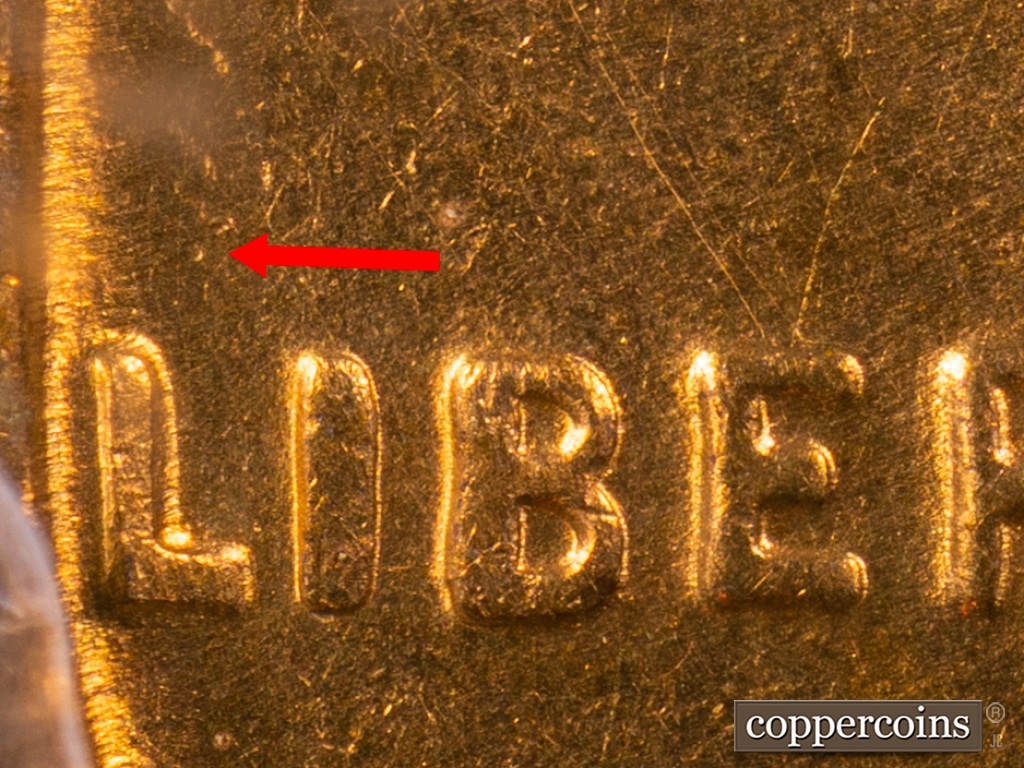 Die-stage F marker on 1938S•1MM•001 showing Dot above LI still visible.