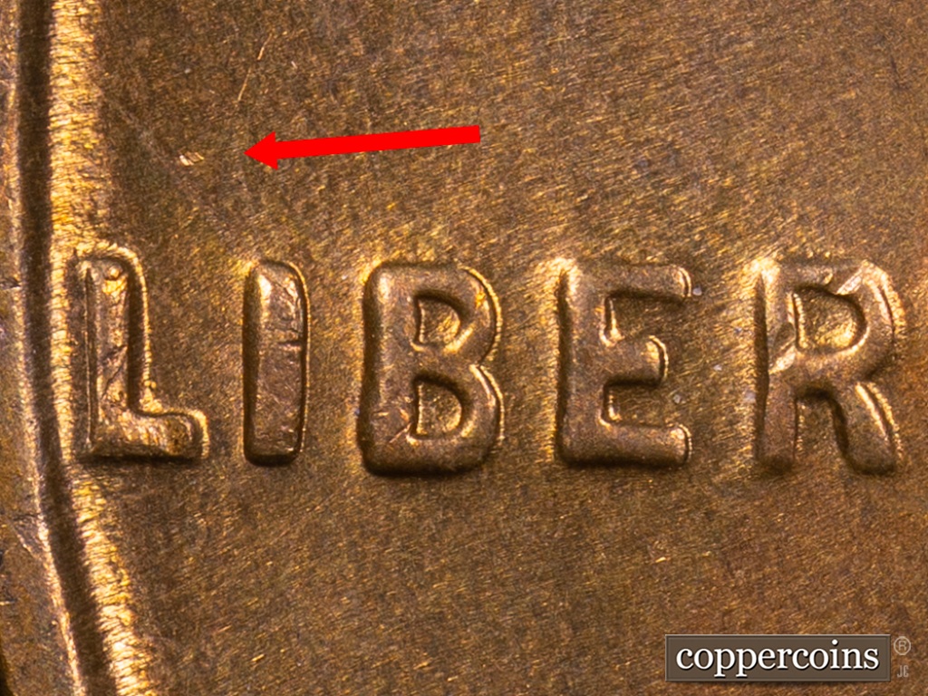 Die-stage E marker on 1938S•1MM•001 showing Dot centered above LI of LIBERTY.