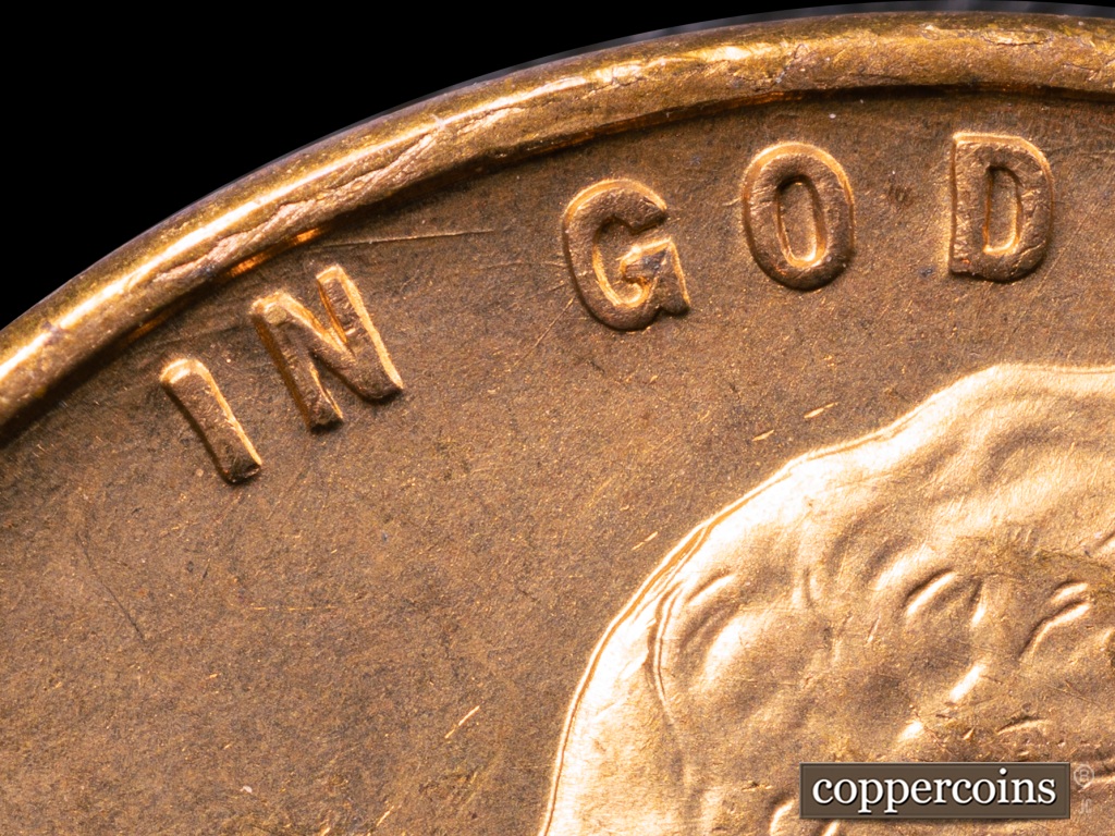 Die-stage A marker on 1938S•1MM•001 showing Die Gouge above N appears in every stage and Stage. Die Scratches fan out from G in GOD in early States.