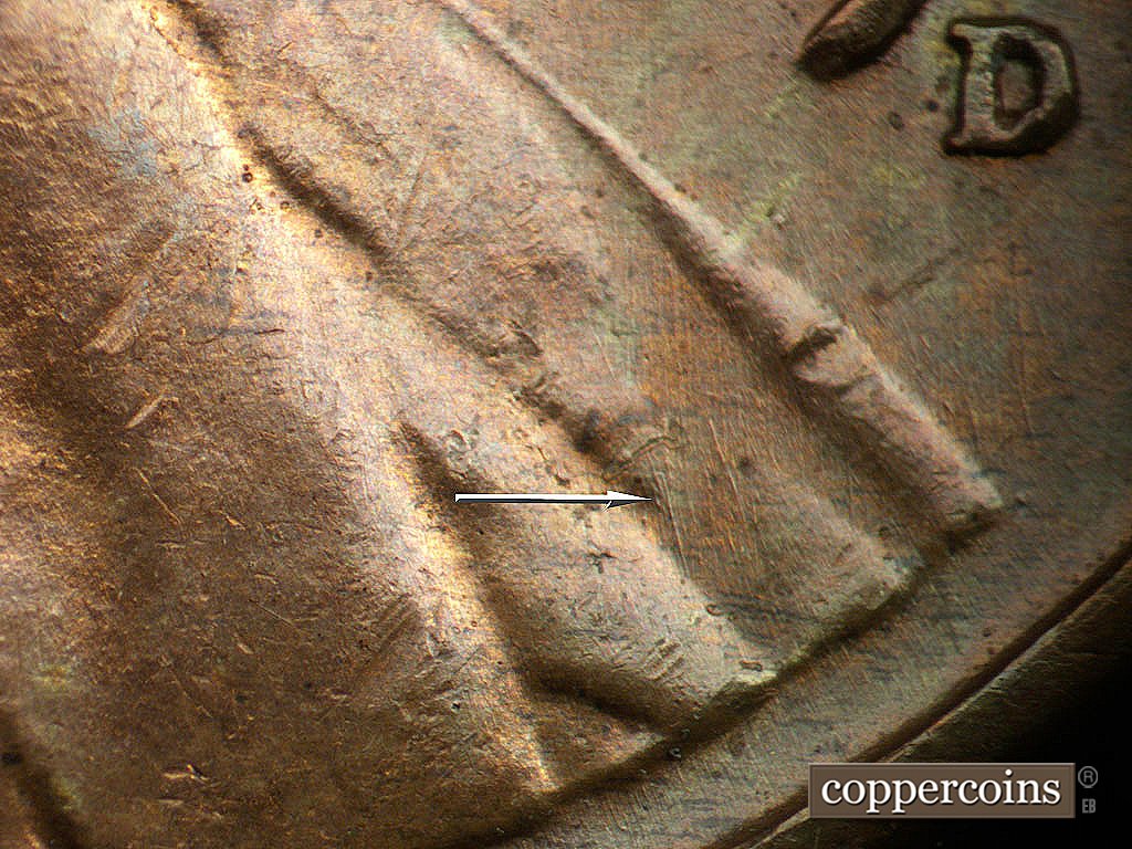 Die-stage B marker on 1941D•1DO•002 showing Generally N/S die scratches on lower lapel.