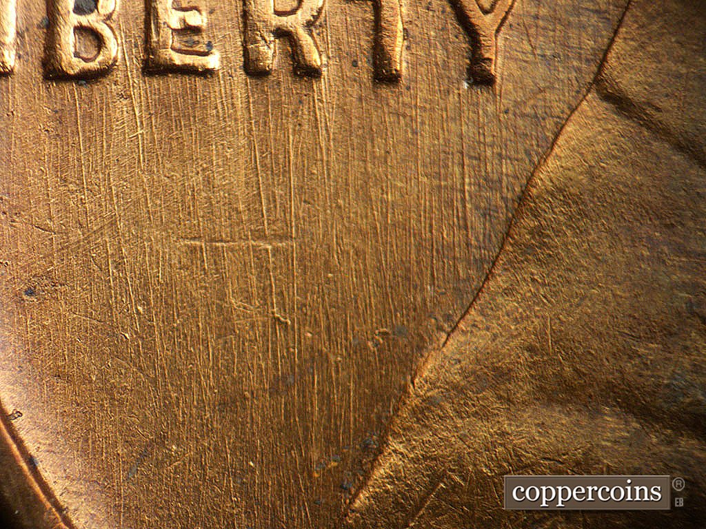 Die-stage B marker on 1941D•1DO•002 showing N/S die scratches through and below LIBERTY.