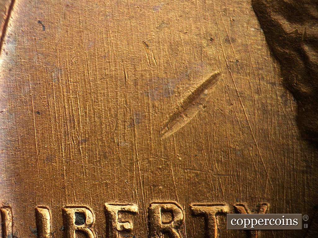 Die-stage B marker on 1941D•1DO•002 showing Generally N?S die scratches through and above LIBERTY, NNW die scratch just above Y in LIBERTY.