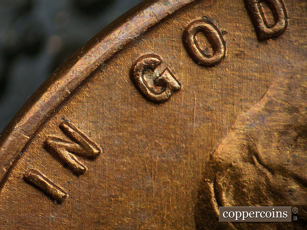 Die-stage B marker on 1941D•1DO•002 showing N/S die scratches through GOD.