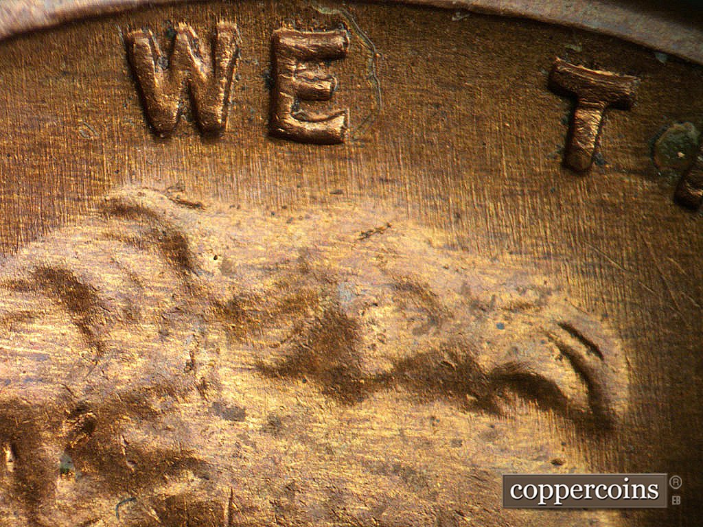 Die-stage B marker on 1941D•1DO•002 showing N/S die scratches through WE.
