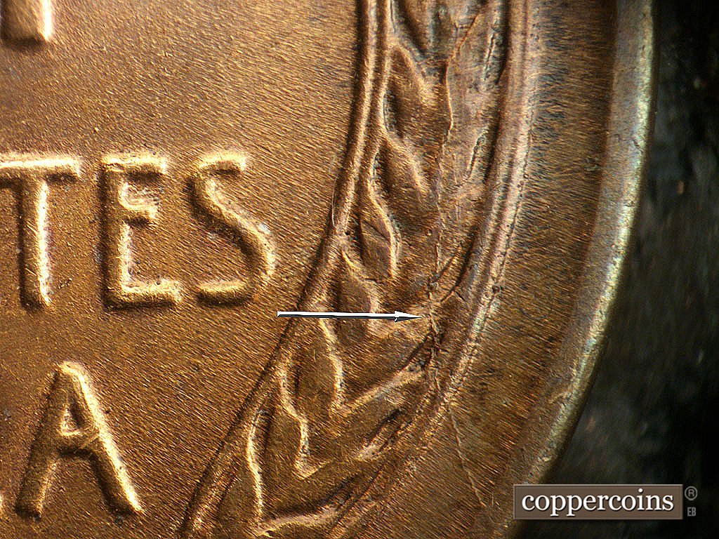 Die-stage B marker on 1941D•1DO•002 showing Die crack through right wheat stalk to rim.