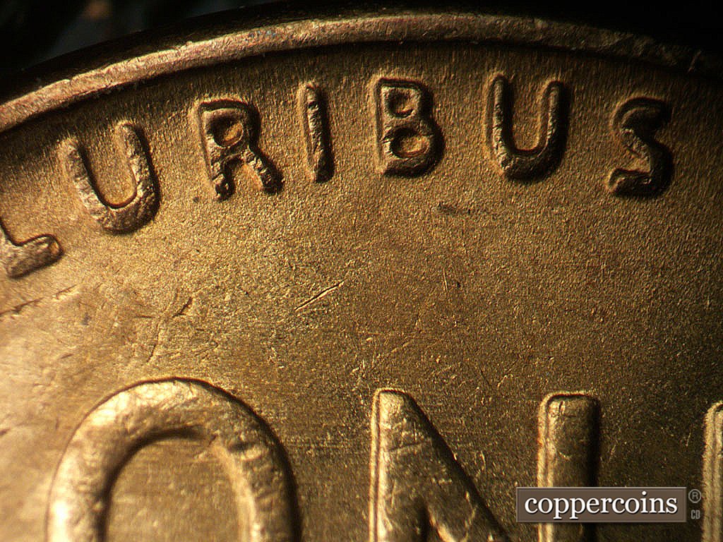 Die-stage B marker on 1942P•1DR•003 showing Extra thickness on PLURIBUS.