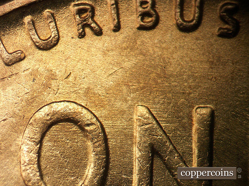Die-stage B marker on 1942P•1DR•003 showing E/W die scratches through ON in ONE.