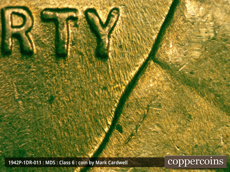 Die-stage B marker on 1942P•1DR•011 (1942 Doubled Die Reverse).
