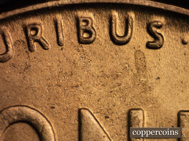 Die-stage B marker on 1942P•1DR•013 (1942 Doubled Die Reverse).