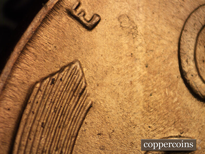 Die-stage B marker on 1942P•1DR•013 (1942 Doubled Die Reverse).