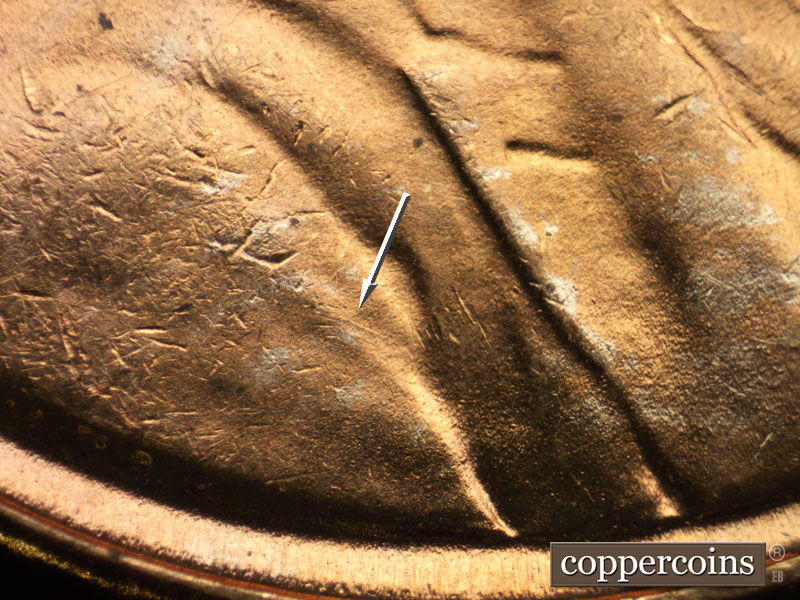 Die-stage C marker on 1942P•1DR•016 (1942 Doubled Die Reverse).