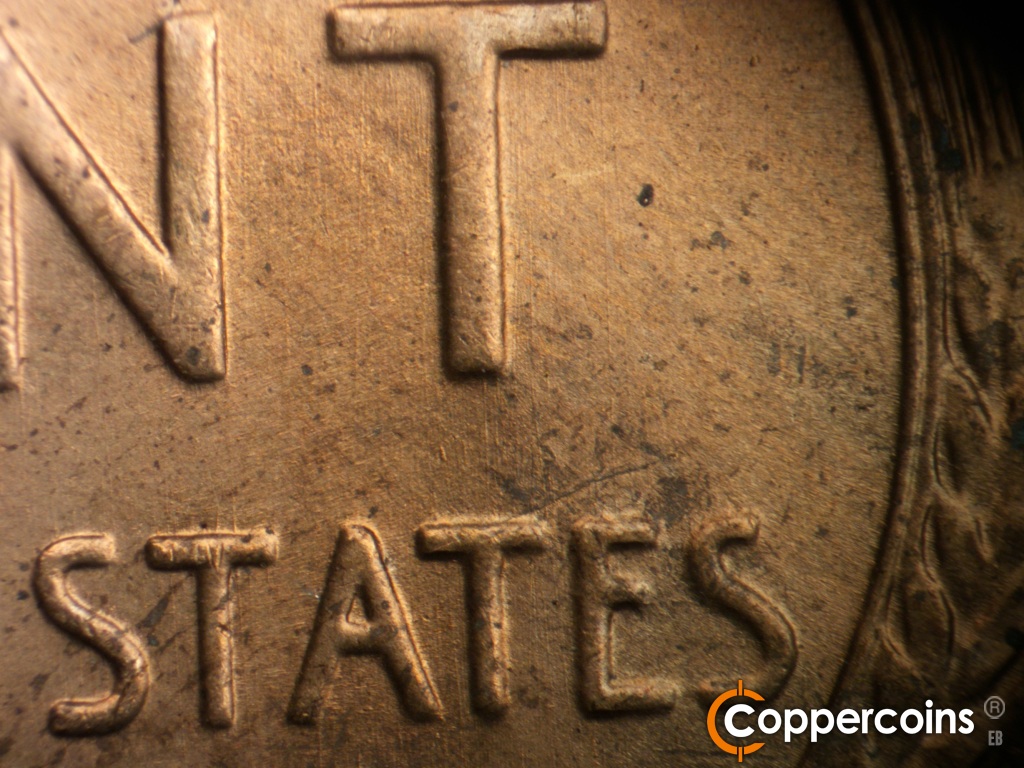 Die-stage A marker on 1942S•1DO•004 showing N/S die scratches through and under T in CENT.