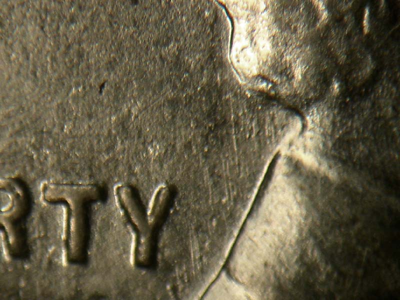 Die-stage B marker on 1943D•1DR•002 (1943 Doubled Die Reverse).