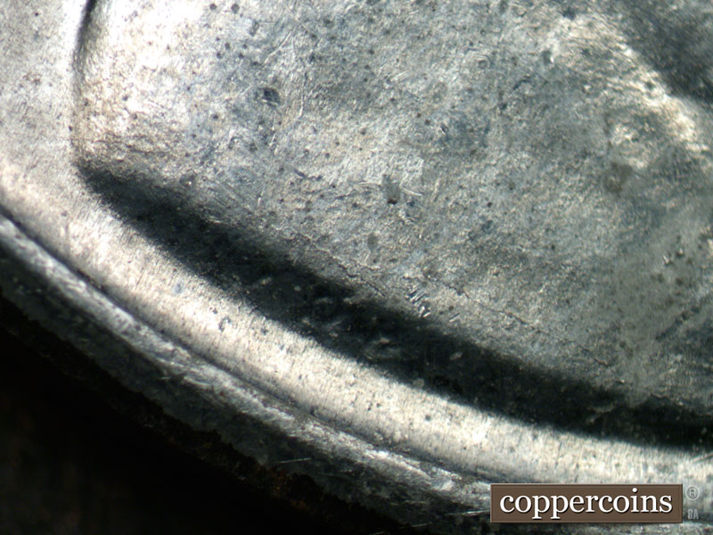 Die-stage B marker on 1943D•1DR•003 (1943 Doubled Die Reverse).