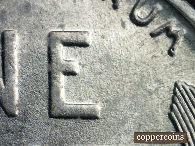 Die-stage B marker on 1943D•1DR•009 (1943 Doubled Die Reverse).