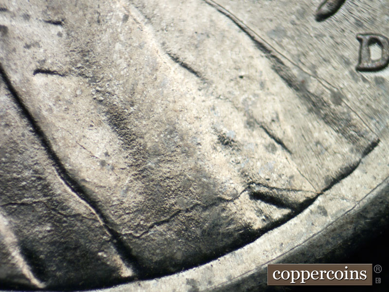 Die-stage B marker on 1943D•1DR•009 (1943 Doubled Die Reverse).