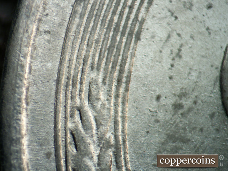 Die-stage B marker on 1943D•1DR•011 (1943 Doubled Die Reverse).