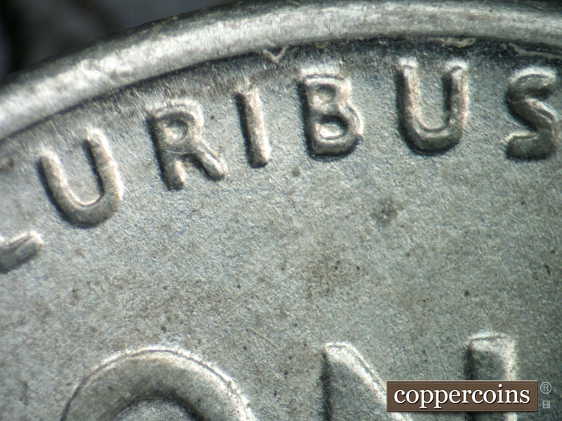 Die-stage B marker on 1943D•1DR•012 (1943 Doubled Die Reverse).