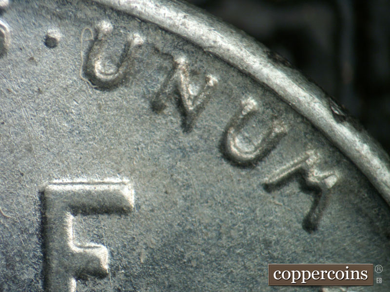 Die-stage B marker on 1943D•1DR•012 (1943 Doubled Die Reverse).