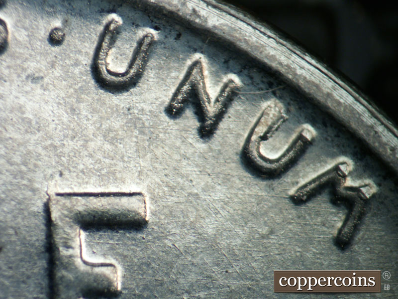 Die-stage B marker on 1943D•1DR•013 (1943 Doubled Die Reverse).