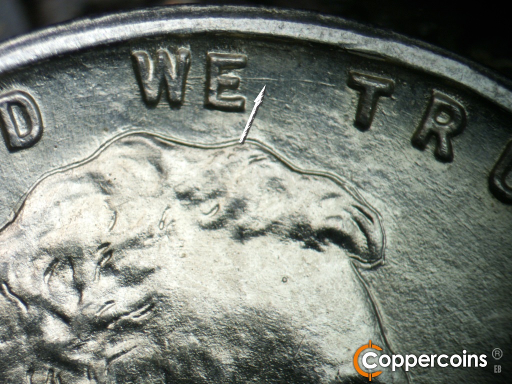 Die-stage A marker on 1943D•1MM•002 showing A deep die scratch runs from the center of the E in WE toward the top of the first T in TRUST.