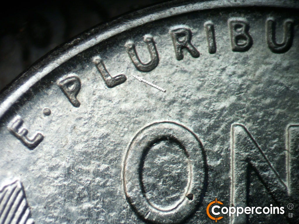 Die-stage A marker on 1943D•1MM•002 showing Light SSW die scratch from first U in PLURIBUS.