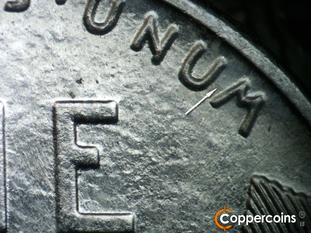 Die-stage A marker on 1943D•1MM•002 showing Short die scratch of light crack connect UM in UNUM.