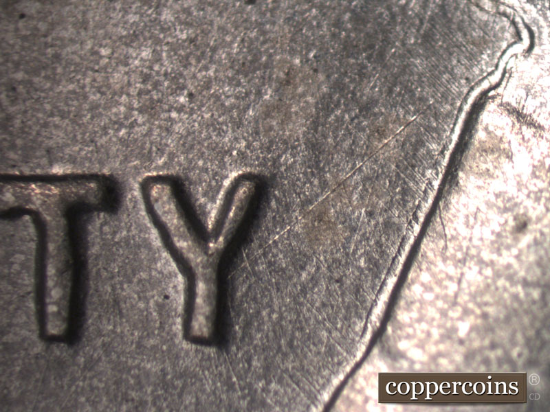 Die-stage B marker on 1943D•1MM•003 (1943 Repunched Mint Mark).
