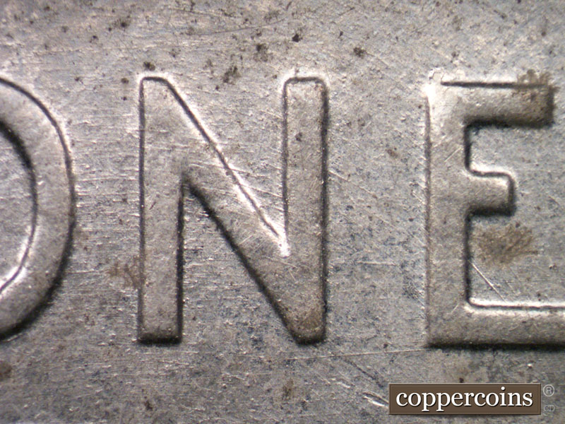 Die-stage B marker on 1943D•1MM•004 (1943 Repunched Mint Mark).