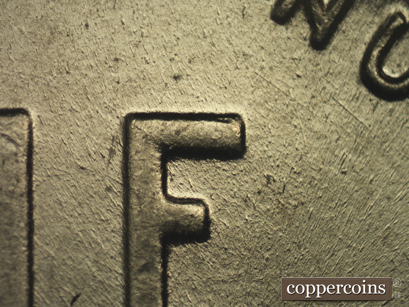 Die-stage B marker on 1943P•1DO•015 (1943 Doubled Die Obverse).