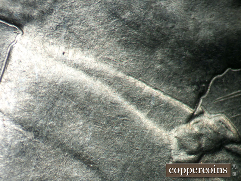 Die-stage B marker on 1943P•1DO•030 (1943 Doubled Die Obverse).