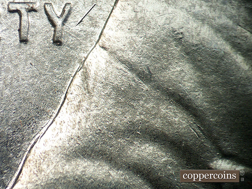 Die-stage A marker on 1943P•1DO•031 showing Pair of SE die scratches from Y in LIBERTY, No die crack on jacket.
