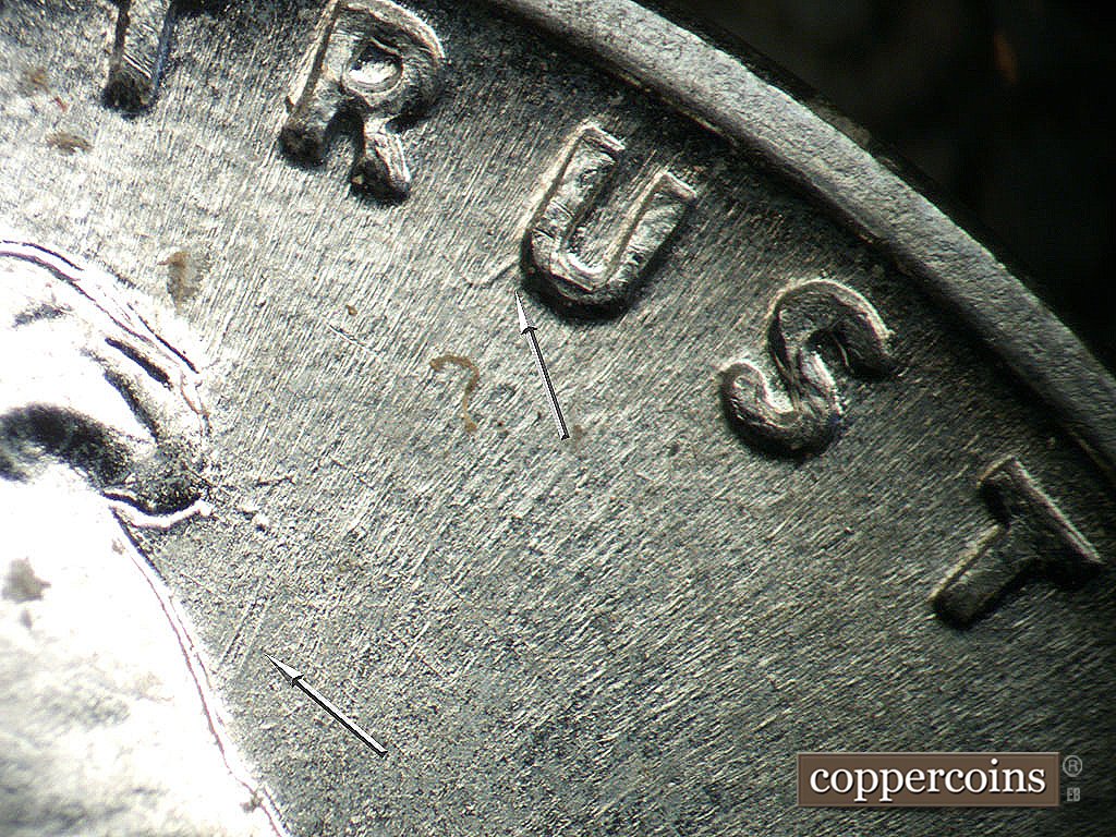 Die-stage A marker on 1943P•1DO•031 showing Die gouge from U in TRUST.