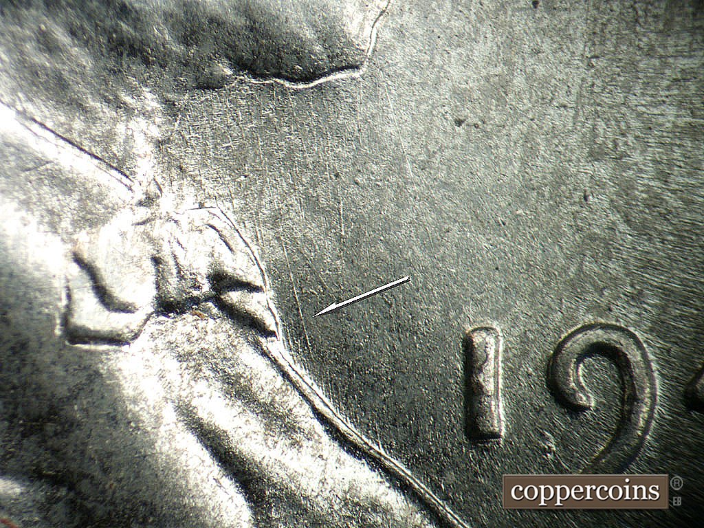 Die-stage A marker on 1943P•1DO•031 showing NNW die scratch in front of bowtie.