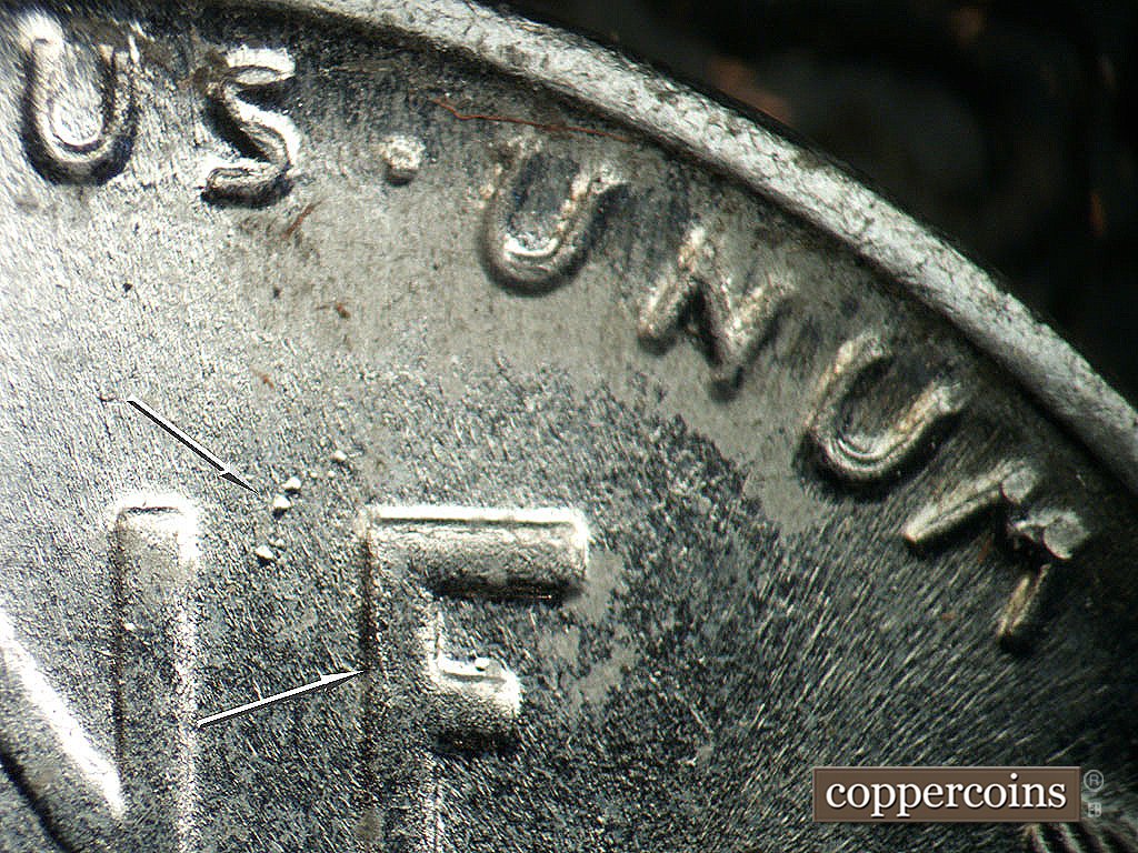 Die-stage A marker on 1943P•1DO•031 showing Die crack down back of E in ONE, Die pitting between NE in ONE.