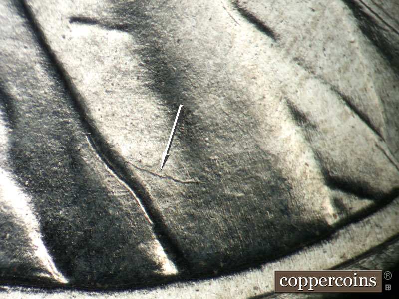 Die-stage B marker on 1943P•1DO•031 showing Die crack on lapel.