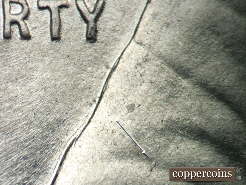 Die-stage B marker on 1943P•1DO•031 showing Die crack from shoulder up into jacket.