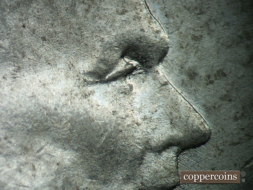 Die-stage B marker on 1943P•1DO•036 showing Extra upper eyelid south of primary.