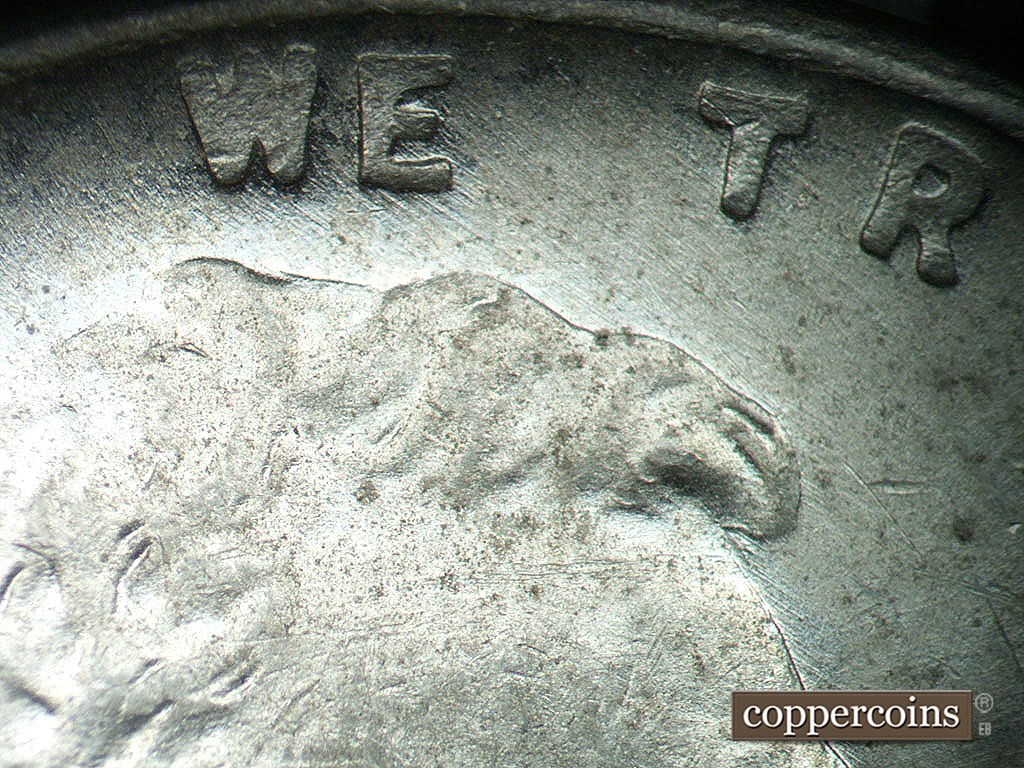 Die-stage B marker on 1943P•1DO•036 showing SE die scratches through WE.