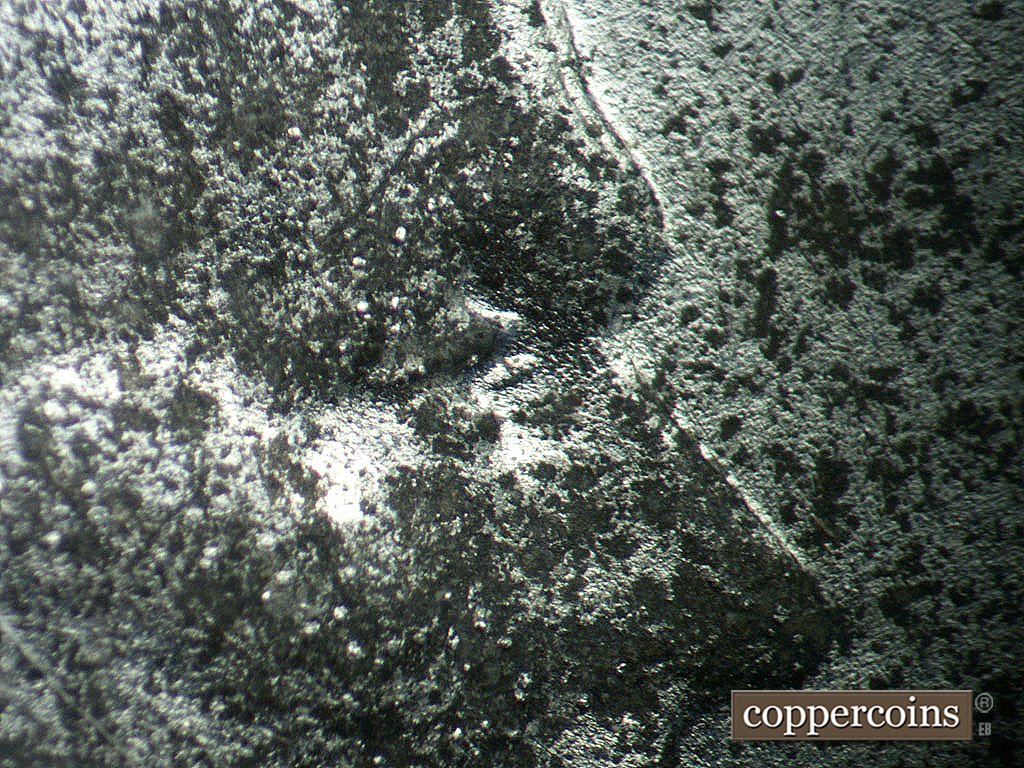 Die-stage B marker on 1943P•1DO•038 showing Extra upper eyelid south of primary.