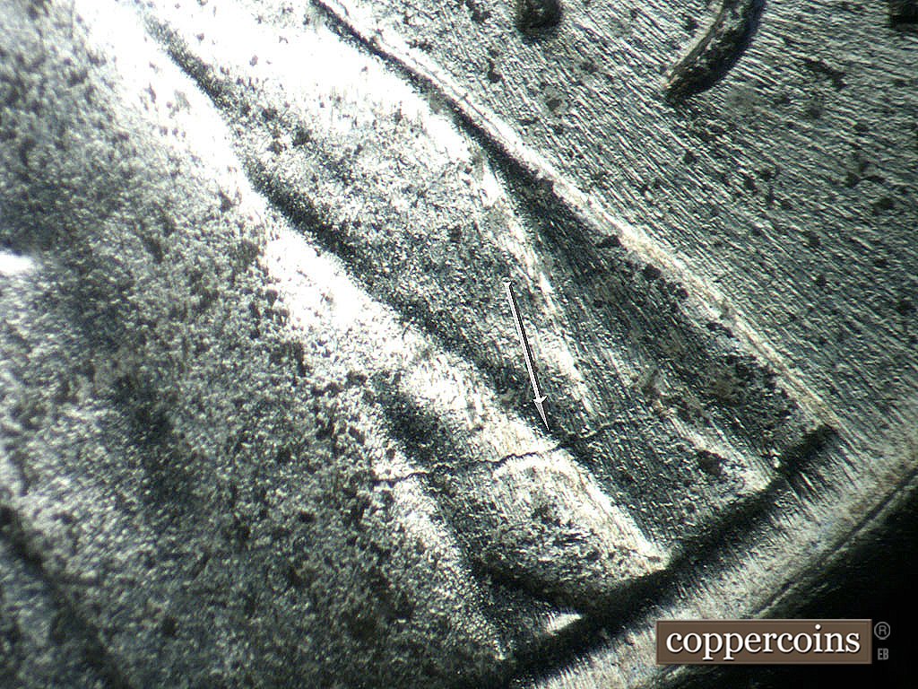 Die-stage B marker on 1943P•1DO•038 showing Die crack across lapel.