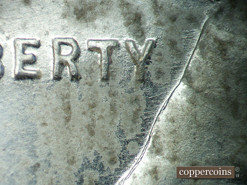 Die-stage B marker on 1943P•1DO•039 showing Short WSW die scratches from back of jacket.