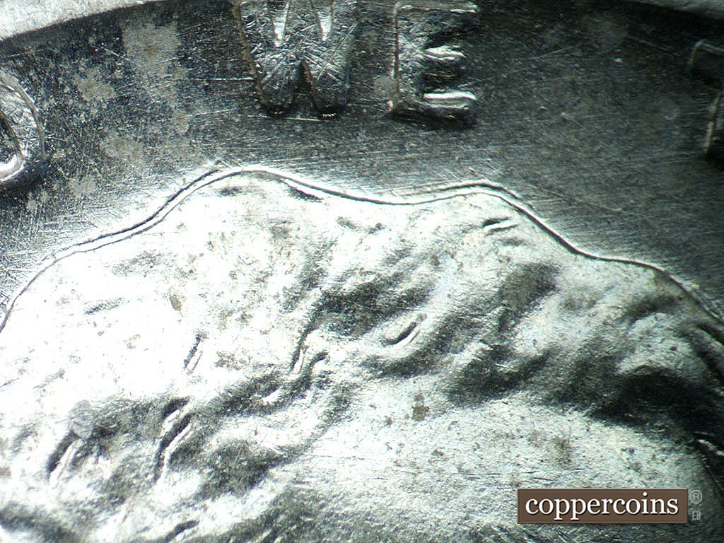 Die-stage B marker on 1943P•1DO•039 showing Die scratches through WE.