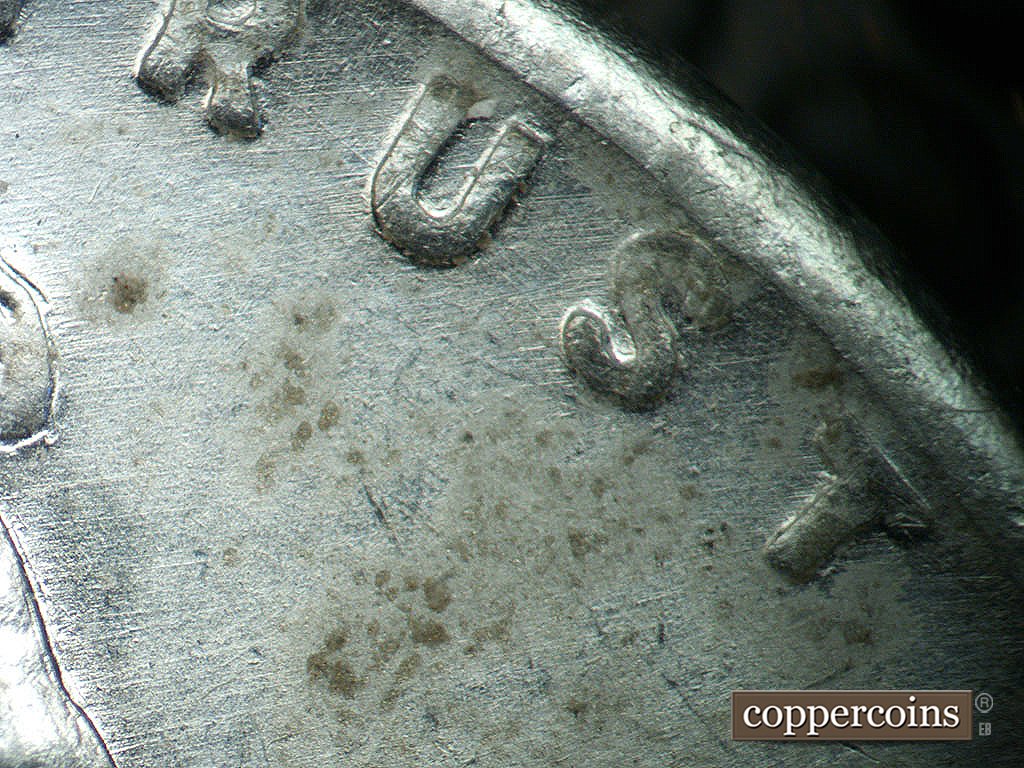 Die-stage B marker on 1943P•1DO•039 showing ENE die scratches from foread to Rim.