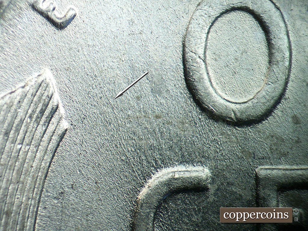 Die-stage B marker on 1943P•1DO•039 showing Unique die scratch from C in CENT to E in E PLURIBUS.