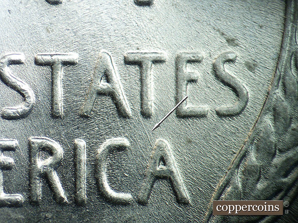 Die-stage B marker on 1943P•1DO•039 showing NW die scratch from last A in AMERICA.